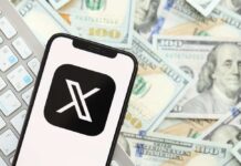 Smartphone displaying the X app logo on a background of cash