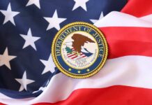 Department of Justice seal on an American flag background
