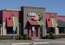 Exterior view of a Chili's restaurant with colorful awnings
