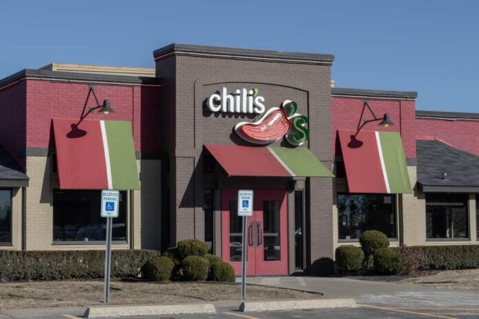 Exterior view of a Chili's restaurant with colorful awnings