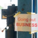 Sign stating 'Going out of Business' attached to a pole