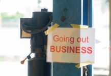 Sign stating 'Going out of Business' attached to a pole