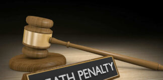 Gavel beside death penalty sign on desk