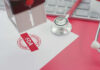 FDA warning stamp near stethoscope and keyboard