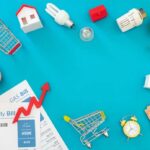 Household bills, piggy banks, and energy items on blue background