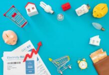 Household bills, piggy banks, and energy items on blue background
