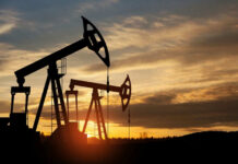 Oil Freefall After Trump’s Big Announcement Oil pump jacks silhouetted against sunrise sky