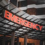 Illuminated emergency sign at a hospital entrance