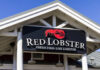 Red Lobster Goes Dark Sign for Red Lobster restaurant displaying fresh fish and live lobster