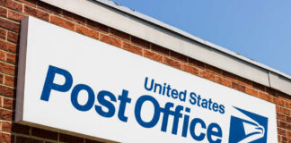 Row of blue United States Postal Service mailboxes