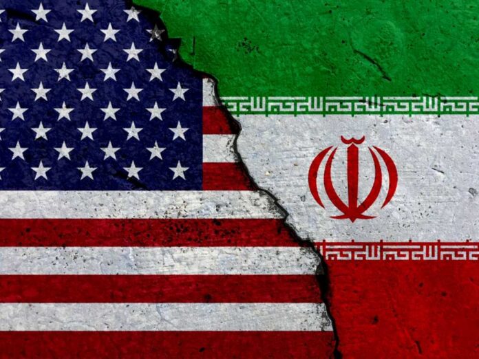 A cracked surface displaying the flags of the USA and Iran