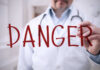 Blurred hospital corridor with medical staff walking