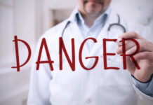 Blurred hospital corridor with medical staff walking