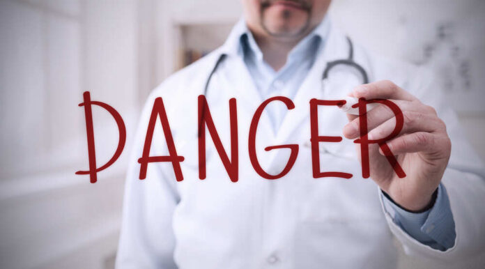 Blurred hospital corridor with medical staff walking