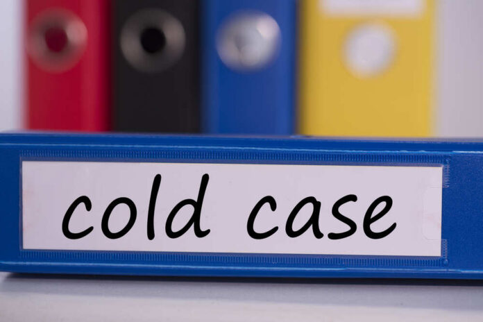 The,Word,Cold,Case,On,Blue,Business,Binder Blue binder labeled 'cold case' with other colored binders in the background