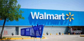 Shopping cart in a Walmart parking lot.