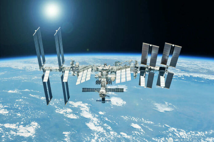 shutterstock_1955801317 International Space Station orbiting above Earth.