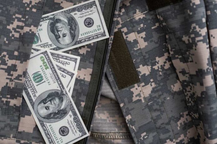 Cash placed inside a military uniform pocket