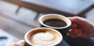Coffee cup on table in cafe interior
