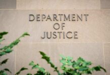 Alleged Mastermind Walks — Case Killed With Prejudice Department of Justice building wall with engraved lettering