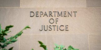 Department of Justice building wall with engraved lettering