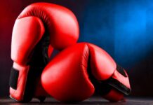 Deadly Road Rage Horror Kills Boxer Red boxing gloves on a dark, textured surface.