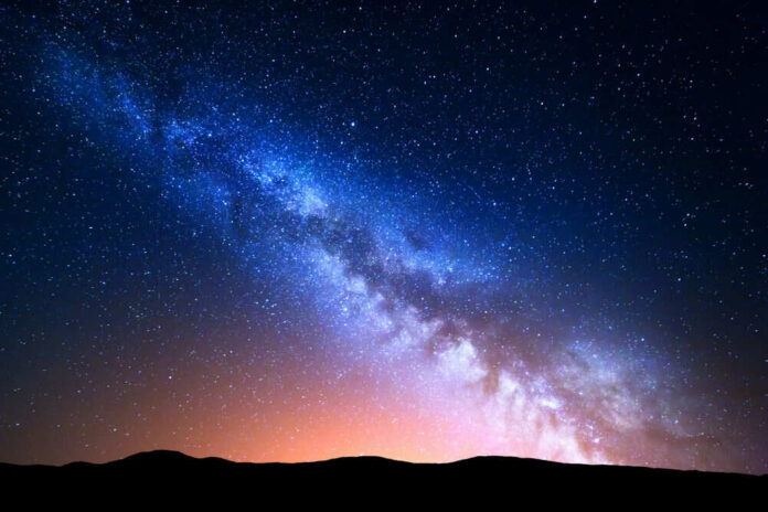 shutterstock_436818499-1 Starry night sky with Milky Way galaxy visible