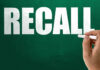 Recall notice over grocery store shelves.
