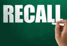 Recall notice over grocery store shelves.
