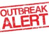 Outbreak alert stamp in red with distressed texture