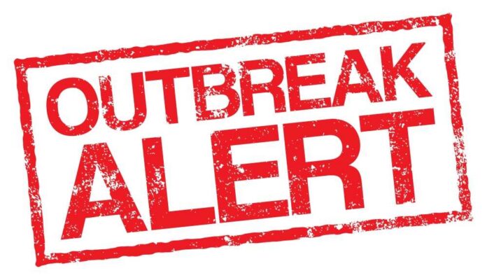 Outbreak alert stamp in red with distressed texture