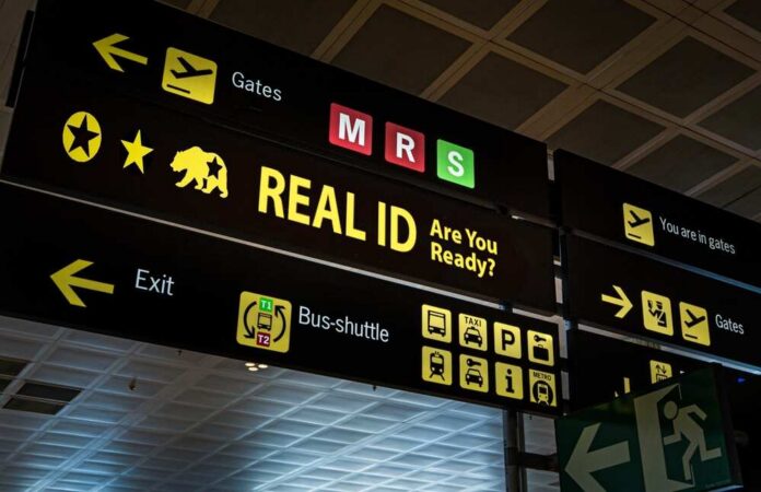 Airport sign displaying directions and information about Real ID