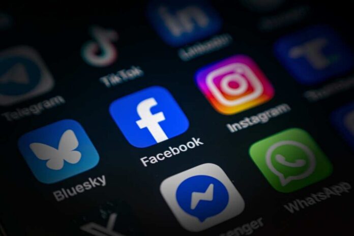 Close-up of various social media application icons on a smartphone screen