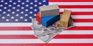 Mini shipping containers on US dollars over an American flag