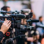 Video cameras on tripods at a media event