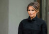 Melania Trump in black coat.