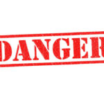 U.S. Issues Warning: Deadly Rituals, Kidnapping Flag Country Red danger stamp on white background