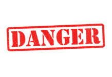 U.S. Issues Warning: Deadly Rituals, Kidnapping Flag Country Red danger stamp on white background