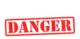 Red danger stamp on white background