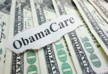 ObamaCare text over money background.
