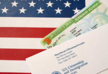 Permanent resident card and official letter on an American flag background