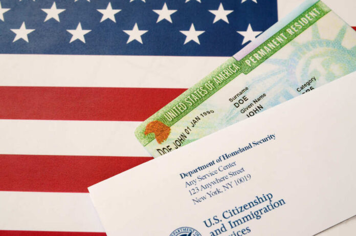 Permanent resident card and official letter on an American flag background