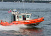 U.S. Coast Guard boat speeding through water