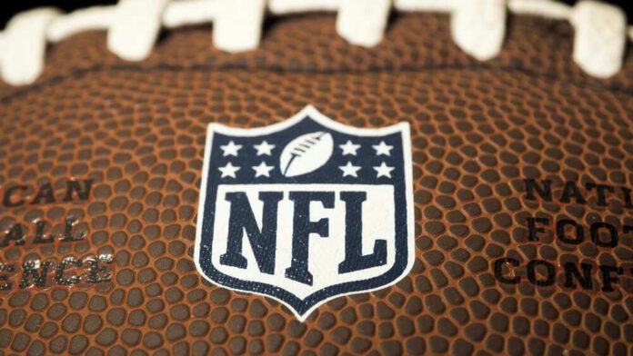 Close-up of NFL logo on American football.
