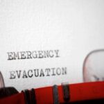 NOW: Evacuation Drills Underway Close-up of a typewritten emergency evacuation notice