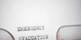 Close-up of a typewritten emergency evacuation notice