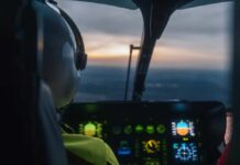 Pilot's view from a helicopter cockpit during sunset