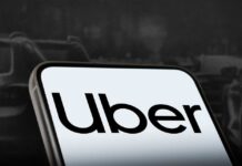 Sign showing Lyft and Uber pickup location.