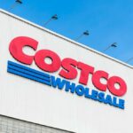 Shock Rationing Hits Important Costco Product Costco Wholesale store sign against a blue sky