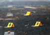 Ninth Body Discovered – Panic Grips Community Yellow evidence markers labeled 8, 9, 10 on pavement.